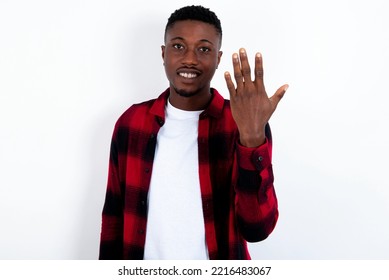 young handsome man wearing red plaid shirt over white  background smiling   looking friendly  showing number five fifth and hand forward  counting down