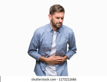 Young handsome man wearing white t-shirt over isolated background with hand on stomach because nausea, painful disease feeling unwell. Ache concept.