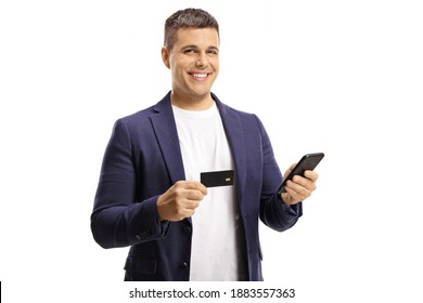 Young Handsome Man With A Wide Smile Using A Credit Card For Online Payment With A Mobile Phone Isolated On White Background