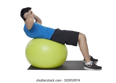 Young Handsome Man Workout With Gym Ball