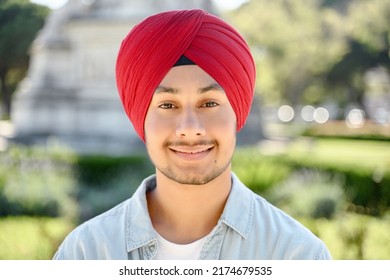 Young Handsome Sikh Guy In Traditional Head Wrap Turban Looking At The Camera And Smiles, Close-up Portrait Of Serene Happy Indian Male Student, Entrepreneur Standing Outdoor