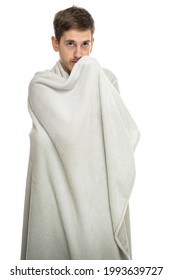 Young Handsome Tall Slim White Man With Brown Hair Covered With Blanket Isolated On White Background