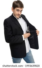 Young Handsome Tall Slim White Man With Brown Hair Hiding Glass Of Water In Black Blazer Isolated On White Background