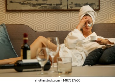 Young Hangover Woman Drinking Coffee Trying To Get Ready For The Day Ahead, Monday Morning Concept, The Morning After Drinking Alcohol	