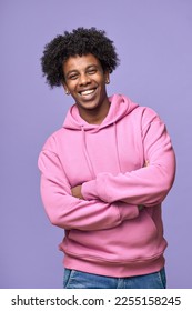 Young happy African American teen guy wearing pink hoodie isolated on purple background. Smiling cool ethnic generation z teenager student model standing looking at camera posing for vertical portrait - Shutterstock ID 2255158245