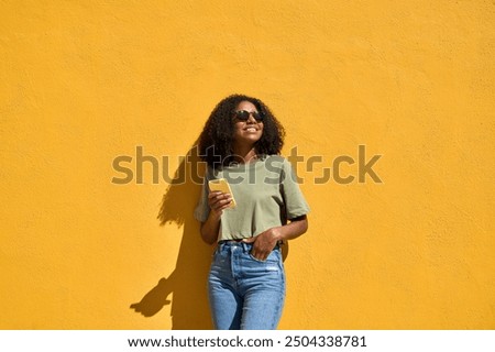 Similar – Image, Stock Photo Young black female standing in studio against yellow and blue lights