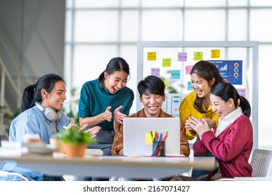 Young happy Asian business man, woman work together, celebrate clap hands in start up office. Creative team brainstorm meeting, businesspeople colleague partnership or office coworker teamwork concept - Shutterstock ID 2167071427