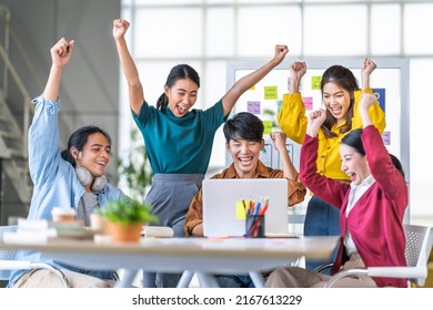 Young happy Asian business man, woman work together, celebrate success in start up office. Creative team brainstorm meeting, businesspeople colleague partnership or office coworker teamwork concept - Shutterstock ID 2167613229