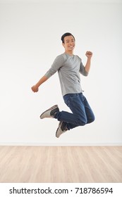 Young Happy Asian Man Jumping