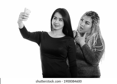 Young Happy Asian Transgender Woman And Fat Asian Woman Smiling While Taking Selfie Picture With Mobile Phone With Fat Woman Posing