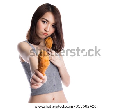 Young happy asian woman holding or giving and eating fries chicken on white background