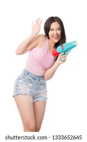 Young Happy Beauty Asian Woman Holding Plastic Water Gun At Songkran Festival, Thailand. Isolated On White Background.