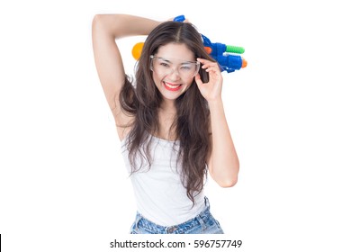 Young happy beauty Asian woman holding plastic water gun at Songkran festival, Thailand. Isolated on white background.