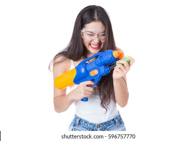 Young Happy Beauty Asian Woman Holding Plastic Water Gun At Songkran Festival, Thailand. Isolated On White Background.