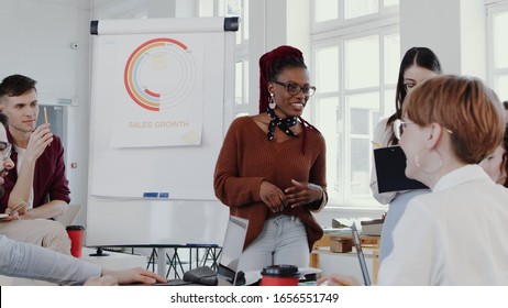 Young Happy Black Woman Boss Leading Team Discussion Meeting At Modern Multiethnic Healthy Office Slow Motion RED EPIC.