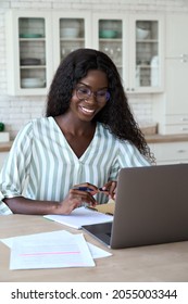 Young Happy Black Woman Student Learning Looking At Laptop Computer Watching Online Webinar, Having Virtual Meeting Working At Home Or Training Seminar Class On Video Call Digital Conference.