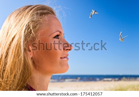 Similar – Portrait of a young woman on the beach