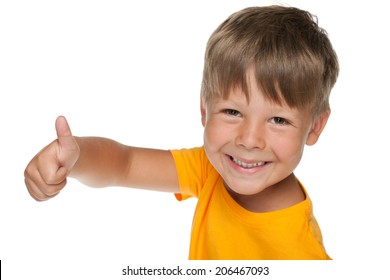 Young Happy Boy Holds His Thumb Up On The White Background