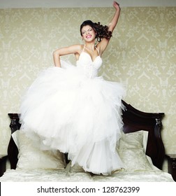 Young Happy Bride Jump On Bed.