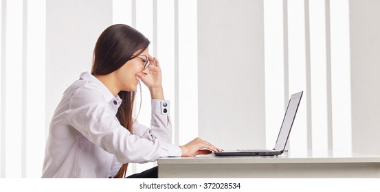 Young Happy Businesswoman Working On Laptop, Side View.