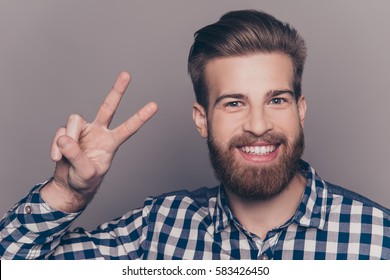 Young Happy Cheerful Man Showing Two Fingers