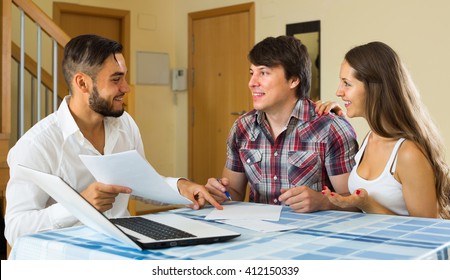 Young Happy Consultant Try Hard To Sign A Contract With Merried Couple