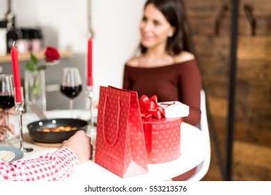 Young Happy Couple Celebrating Valentine's Day With A Dinner At Home 