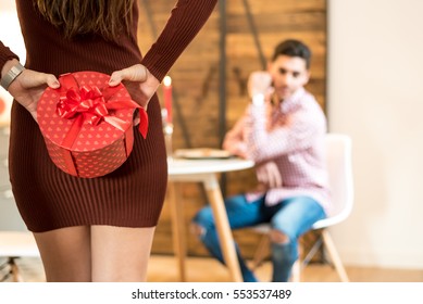 Young Happy Couple Celebrating Valentine's Day With A Dinner At Home
