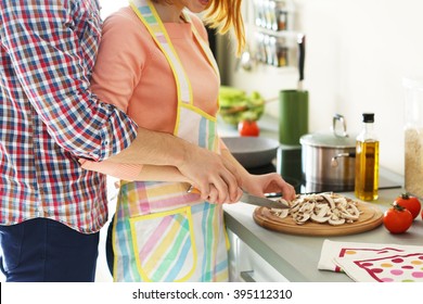 Young Happy Couple Cooking Together, Close Up