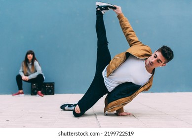 Young Happy Couple Dancing On The Street With A Vintage Radio Cassette Stereo 
