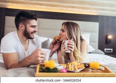 Young Happy Couple Having Breakfast In Luxury Hotel Room. 