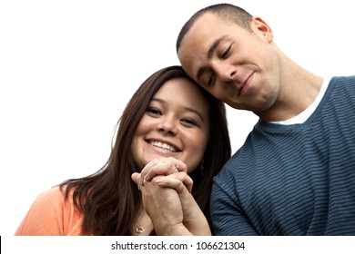 Young Happy Couple Holding Hands And Showing The Diamond Engagement Ring.  Shallow Depth Of Field With Strongest Focus On The Ring.