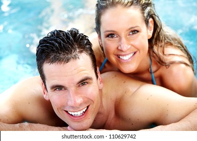 Young happy couple in jacuzzi. Spa relax.