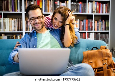 Young Happy Couple With Laptop At Home