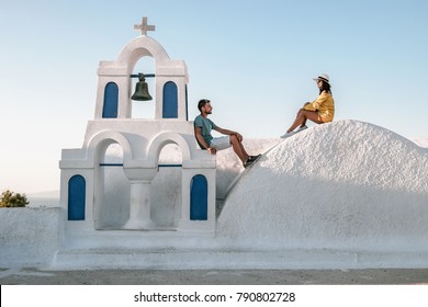 Young Happy Couple Man And Woman At A Greek Church In Oia Thira Cyalides Santorini Greece