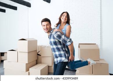 Young Happy Couple Moving In New House