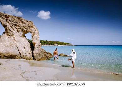 Young Happy Couple On Seashore Crete Greece, Men, And Woman Voulisma Beach Crete Greece. Europe