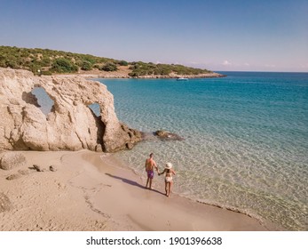 Young Happy Couple On Seashore Crete Greece, Men, And Woman Voulisma Beach Crete Greece. Europe