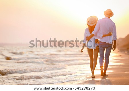 Young happy couple on seashore