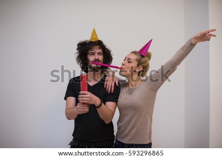 Similar – Image, Stock Photo Young happy couple enjoying a birthday party