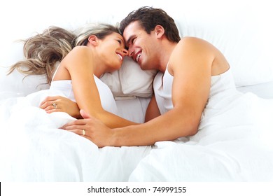 Young Happy Couple Sleeping In Bed. Love.