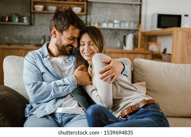 Young happy couple spending their time at home - Shutterstock ID 1539694835