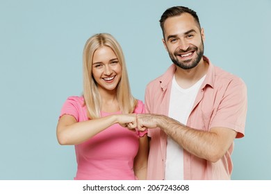 Young Happy Couple Two Friends Family Man Woman In Casual Clothes Looking Camera Give Fist Bump Together Isolated On Pastel Plain Light Blue Color Background Studio Portrait People Lifestyle Concept