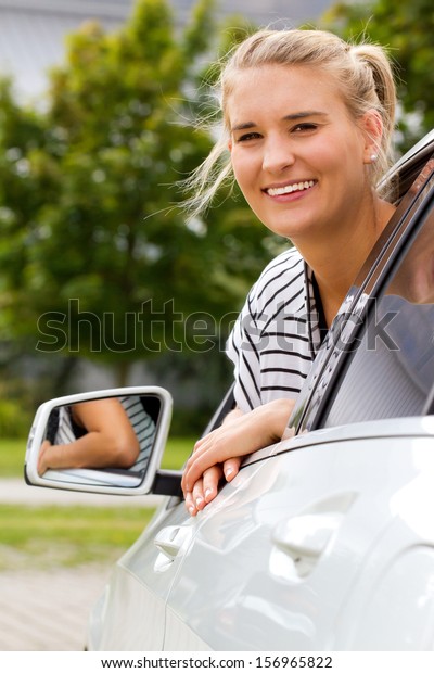 Young happy driver looking\
back 