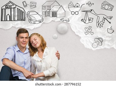Young Happy Family Couple Dreaming Of Future Wealthy Life