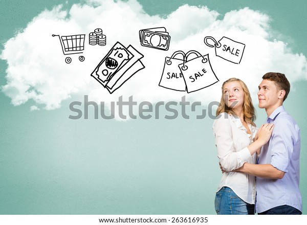 Young\
happy family couple dreaming of future wealthy\
life