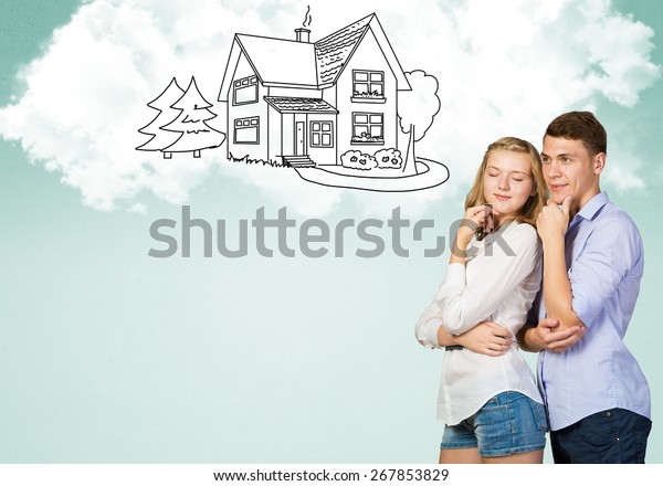 Young
happy family couple dreaming of future wealthy
life