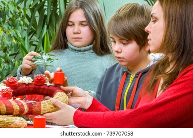 The Young Happy Family Is Getting Ready For The Christmas And Advent Celebrations