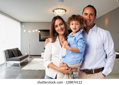 Young Happy Family At Home