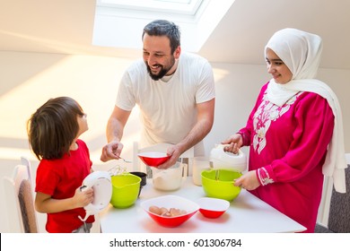 Young happy family making food together - Powered by Shutterstock